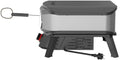 Der Cozze 13 Zoll Pizzaofen PREMIUM ROTATE, elektrisch 230V (CH-Stecker) von Cozze hat ein kompaktes, schwarz-silbernes, rechteckiges Design, steht auf vier Beinen, hat ein Stromkabel und eine Metallthermometersonde für präzises Kochen.
