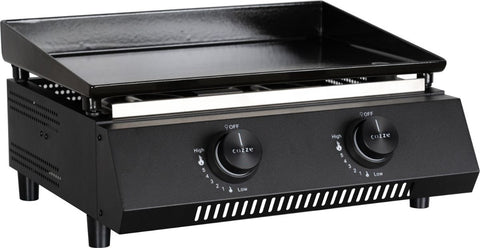 Die Cozze G-400 Plancha von Cozze ist eine schwarze Gas-Tischgrillplatte mit zwei Bedienknöpfen, flacher Oberfläche und belüfteten Seiten - ideal für den Innen- oder Außenbereich als kompakte Plancha (Gas 50mbar, CH-Regler).